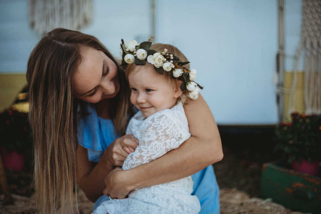 mom holding child