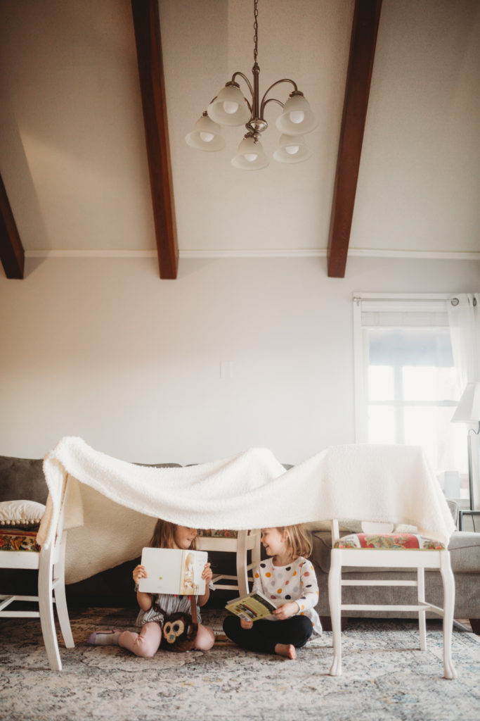 kids playing in fort at home